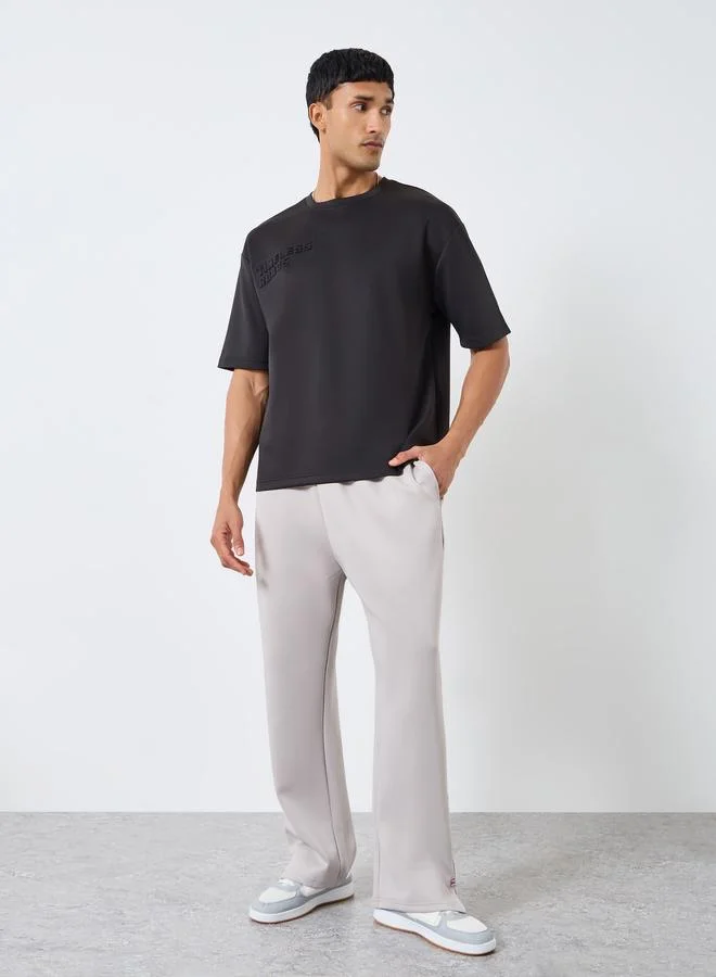 Styli Men Black Oversized Chest Embossed T-Shirt